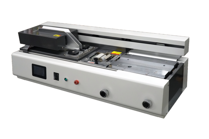 Industrial laminator or heat-sealing machine with front control panel and rollers on a pale orange background